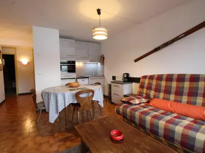 a living room with a table and a couch at 3P 6 Pers, Cuisine rénovée, Balcon Sud, Proche Pistes et Commerces, Parking, Casier à skis - FR-1-572-204 in Arâches-la-Frasse