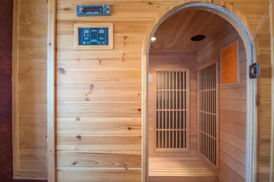 a wooden sauna with an archway in a house at L'écrin des Bossons in Chamonix-Mont-Blanc
