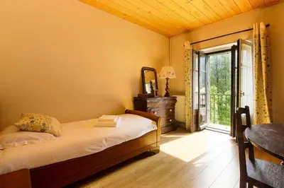 a bedroom with a bed with towels on it at Maison Emile Devouassoud in Chamonix-Mont-Blanc