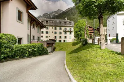 a road leading to a building in a city at Maison Emile Devouassoud in Chamonix-Mont-Blanc