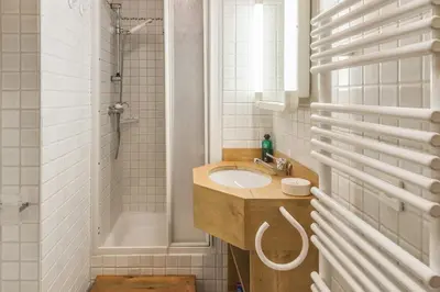a bathroom with a sink and a shower at Appartement Lanura - Welkeys in Megève