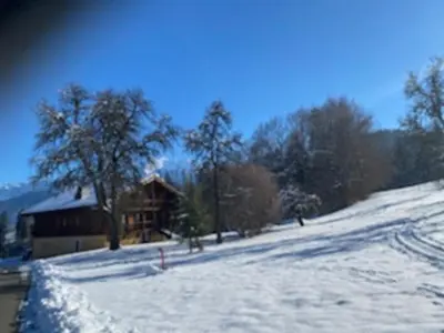 a snow covered hill with a cabin in the background at Chalet rénové 3 étoiles, 14 pers, vue Mont Blanc, Wifi - FR-1-560-102 in Cordon