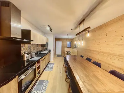 a living room with a couch and a television at gcf210 in Les Carroz d'Araches