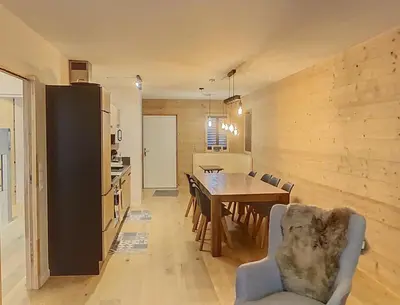 a living room with a television and a window at gcf210 in Les Carroz d'Araches
