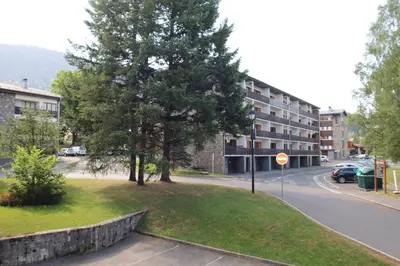 a large tree in front of a house at mlb22 in Les Carroz d'Araches