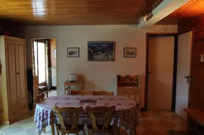 a log cabin with a tree in front of it at mlb22 in Les Carroz d'Araches