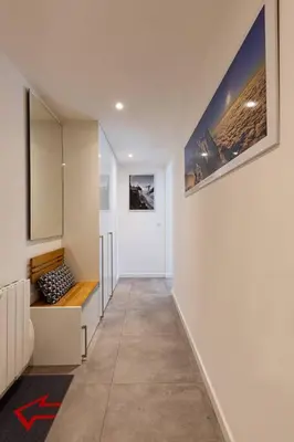 a hallway of a house with white walls at Modern 2BR 5* pool gym spa garage Mont-Blanc view in Chamonix-Mont-Blanc