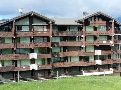 a snow covered ski slope with houses and trees at 3 Pièces au pied des pistes - Morillon 1100, 6-7 pers, TV - FR-1-815-89 in Morillon