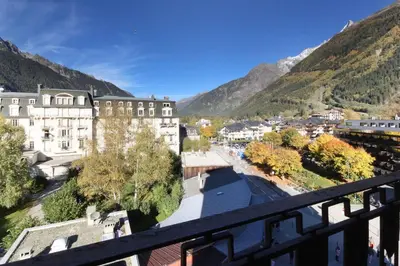 a view from a balcony of a town with mountains at Carlton - Center of Chamonix - Historic building in Chamonix-Mont-Blanc