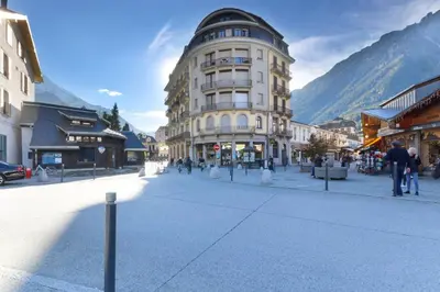 a street in a town with a tall building at Carlton - Center of Chamonix - Historic building in Chamonix-Mont-Blanc