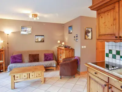 a living room with a couch and a table at Appartement 6 pers, Chamonix, Parking - FR-1-343-169 in Chamonix-Mont-Blanc