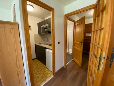 a small kitchen with a sink and a stove at Studio cosy avec Wifi au pied des pistes - 4 pers. - FR-1-343-154 in Chamonix-Mont-Blanc