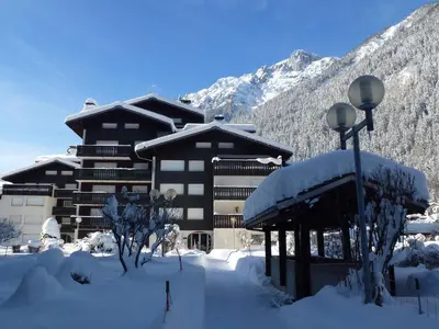 a building with snow on the ground in front of it at Studio cosy avec Wifi au pied des pistes - 4 pers. - FR-1-343-154 in Chamonix-Mont-Blanc
