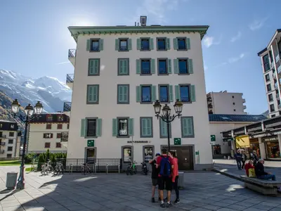 a group of people standing in front of a building at Bel appartement 3 étoiles avec balcon au cœur de Chamonix - FR-1-343-165 in Chamonix-Mont-Blanc
