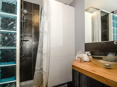 a bathroom with a sink and a shower at Bel appartement 3 étoiles avec balcon au cœur de Chamonix - FR-1-343-165 in Chamonix-Mont-Blanc