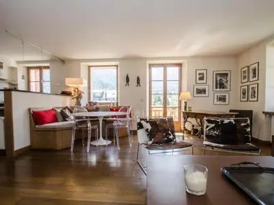 a living room with a couch and a table at Appartement spacieux à Chamonix, 3 chambres, WiFi - FR-1-343-176 in Chamonix-Mont-Blanc