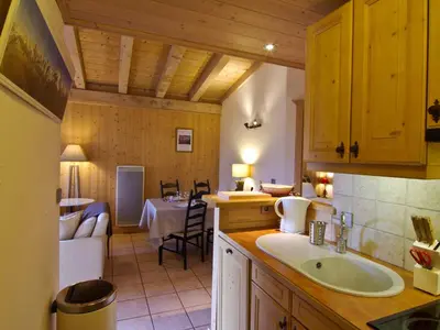 a kitchen with a sink and a living room at Bel appartement 3 étoiles avec parking et wifi, proche pistes à Chamonix - FR-1-343-168 in Chamonix-Mont-Blanc