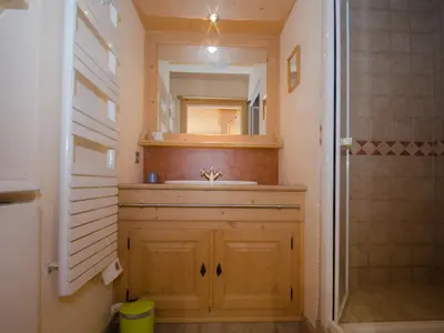 a bathroom with a sink and a mirror at Bel appartement au cœur de Chamonix, près des pistes, avec parking - FR-1-343-163 in Chamonix-Mont-Blanc
