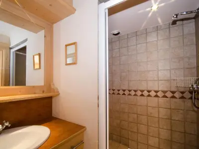 a bathroom with a sink and a shower at Bel appartement au cœur de Chamonix, près des pistes, avec parking - FR-1-343-163 in Chamonix-Mont-Blanc