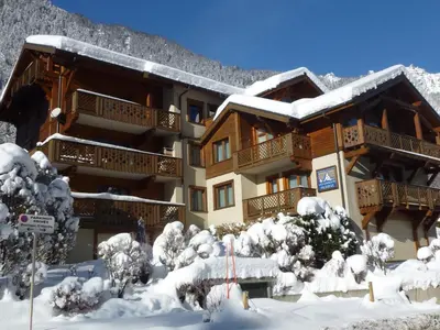 a ski lodge in the snow with snow covered trees at Bel appartement duplex pour 8, proche pistes à Chamonix avec wifi et parking - FR-1-343-188 in Chamonix-Mont-Blanc