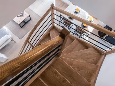 an overhead view of a staircase with wood and metal railings at Duplex 3 étoiles pour 6 pers, Chamonix, parking privé - FR-1-343-189 in Chamonix-Mont-Blanc