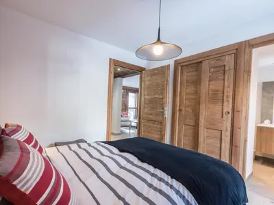 a bedroom with a bed and a pendant light at Duplex 3 étoiles pour 6 pers, Chamonix, parking privé - FR-1-343-189 in Chamonix-Mont-Blanc