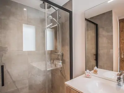 a bathroom with a shower and a sink at Duplex 3 étoiles pour 6 pers, Chamonix, parking privé - FR-1-343-189 in Chamonix-Mont-Blanc