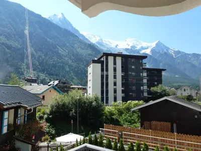 a view of a city with mountains in the background at Charmant appartement au cœur de Chamonix avec parking et animaux acceptés - FR-1-343-187 in Chamonix-Mont-Blanc