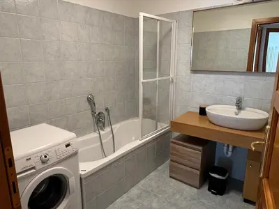 a bathroom with a washing machine and a sink at Charmant appartement au cœur de Chamonix avec parking et animaux acceptés - FR-1-343-187 in Chamonix-Mont-Blanc