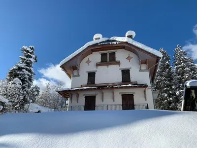 a house with a roof covered in snow at Appartement rénové avec vue Mont-Blanc, parking et WiFi à Chamonix - FR-1-343-206 in Chamonix-Mont-Blanc