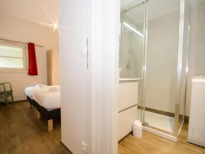 a bathroom with a shower and a bedroom with a bed at Appartement rénové avec vue Mont-Blanc, parking et WiFi à Chamonix - FR-1-343-206 in Chamonix-Mont-Blanc