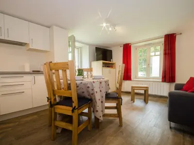 a kitchen and dining room with a table and chairs at Appartement rénové avec vue Mont-Blanc, parking et WiFi à Chamonix - FR-1-343-206 in Chamonix-Mont-Blanc