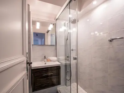 a bathroom with a shower and a sink at Appartement spacieux à Chamonix avec terrasse et parking privé - FR-1-343-173 in Chamonix-Mont-Blanc