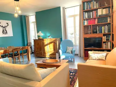 a living room with a couch and a dining room at Superbe 4* Appartement de 3 Chambres au Cœur de Chamonix avec Wifi - FR-1-343-186 in Chamonix-Mont-Blanc