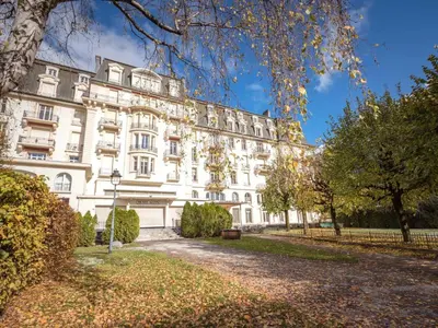 a large white building with trees in front of it at Superbe 4* Appartement de 3 Chambres au Cœur de Chamonix avec Wifi - FR-1-343-186 in Chamonix-Mont-Blanc