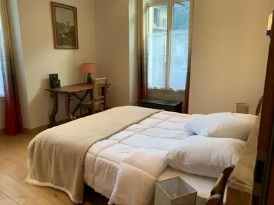 a bedroom with a large white bed with a window at Superbe 4* Appartement de 3 Chambres au Cœur de Chamonix avec Wifi - FR-1-343-186 in Chamonix-Mont-Blanc