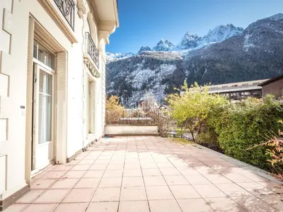 a balcony of a building with a view of mountains at Superbe 4* Appartement de 3 Chambres au Cœur de Chamonix avec Wifi - FR-1-343-186 in Chamonix-Mont-Blanc