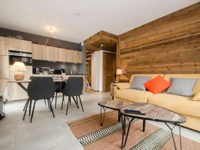 a living room with a couch and a table at Appartement chalet à Chamonix avec wifi et parking privé - FR-1-343-201 in Chamonix-Mont-Blanc