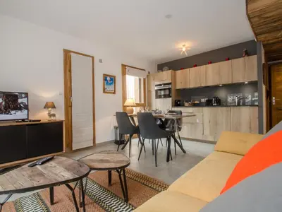 a living room with a couch and a table at Appartement chalet à Chamonix avec wifi et parking privé - FR-1-343-201 in Chamonix-Mont-Blanc