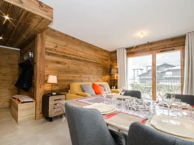 a dining room with a table and chairs at Appartement chalet à Chamonix avec wifi et parking privé - FR-1-343-201 in Chamonix-Mont-Blanc