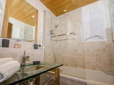 a bathroom with a glass sink and a shower at Charmant appartement à Chamonix avec parking, proche du centre - FR-1-343-203 in Chamonix-Mont-Blanc