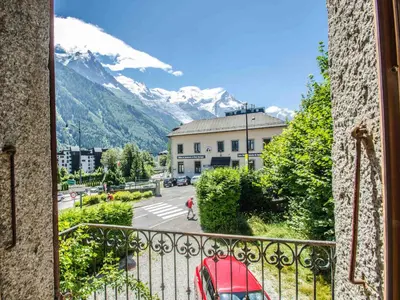 a balcony with a view of a mountain at Appartement central à Chamonix avec parking et wifi, proche pistes - FR-1-343-194 in Chamonix-Mont-Blanc