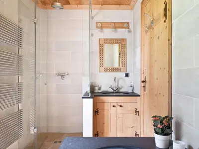 a bathroom with a sink and a shower at Superbe appartement avec cheminée à Argentière - FR-1-343-192 in Chamonix-Mont-Blanc