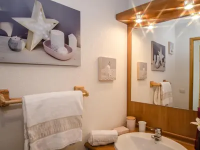 a bathroom with a sink and a mirror at Appartement calme 3 étoiles avec Wi-Fi et parking, Chamonix - FR-1-343-212 in Chamonix-Mont-Blanc