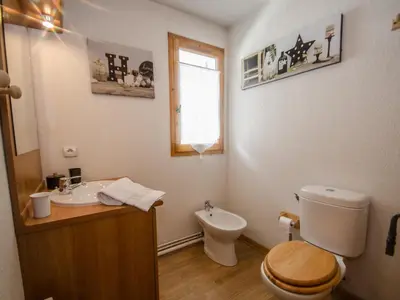 a bathroom with a toilet and a sink at Appartement calme 3 étoiles avec Wi-Fi et parking, Chamonix - FR-1-343-212 in Chamonix-Mont-Blanc