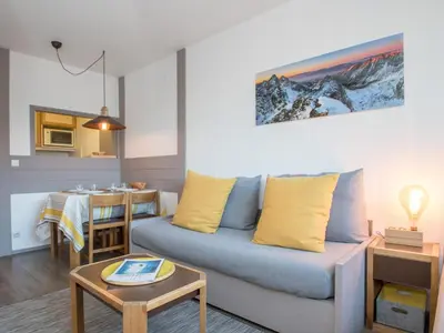 a living room with a couch and a table at Charmant appartement à Chamonix avec parking et wifi - FR-1-343-208 in Chamonix-Mont-Blanc