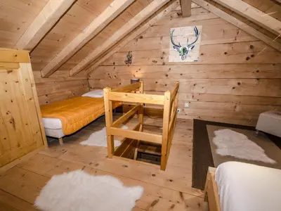 a room with a bed and a desk in a cabin at Charmant mazot avec jardin, animaux admis, parking, wifi - FR-1-343-215 in Chamonix-Mont-Blanc