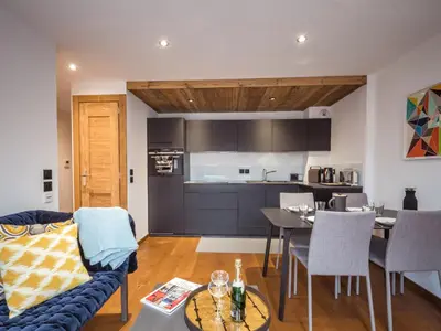 a living room with a couch and a table at Appartement moderne avec balcon et parking à Chamonix - FR-1-343-220 in Chamonix-Mont-Blanc