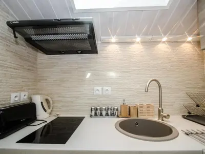 a kitchen with a sink and a microwave at Bel appartement 4 pers avec parking et balcon à Chamonix - FR-1-343-214 in Chamonix-Mont-Blanc