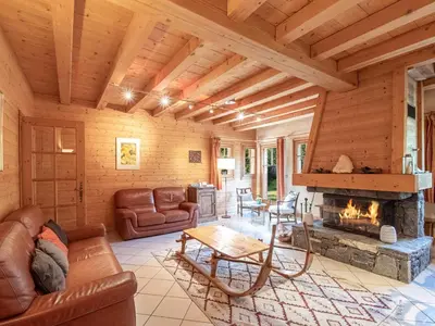 a living room with a couch and a fireplace at Chalet de charme à Chamonix avec WiFi et parking privé pour 12 pers. - FR-1-343-226 in Chamonix-Mont-Blanc